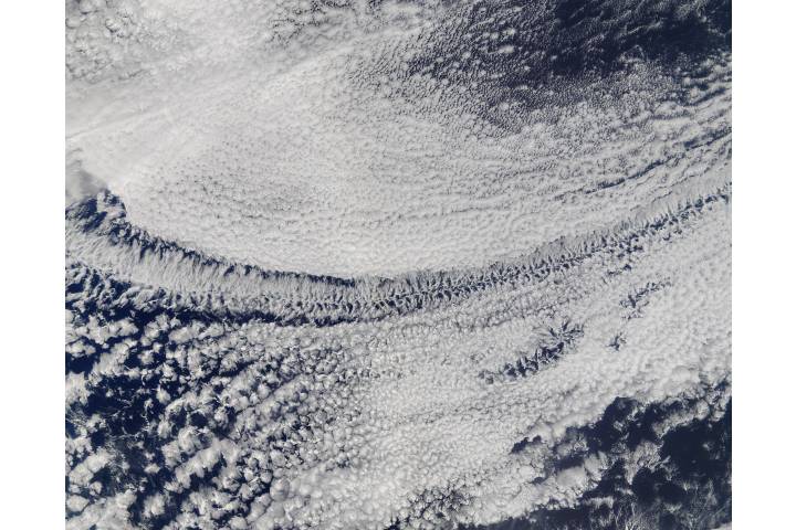 Satellite view of open-cell and closed-cell clouds over the Pacific Ocean